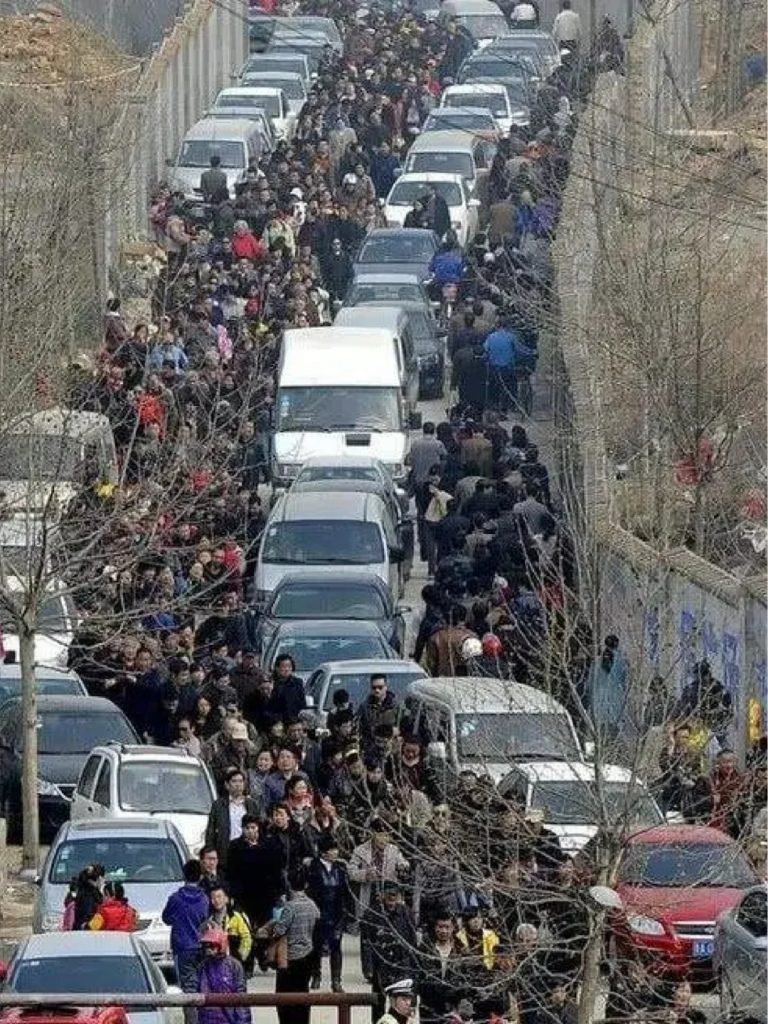 Crowded with people and cars